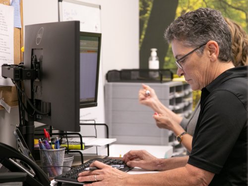 Greentech Renewables Employee at the Computer